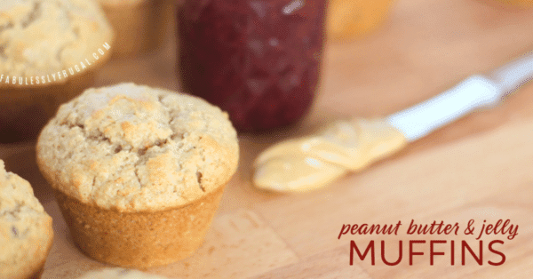 Knife with peanut butter on it next to peanut butter jelly muffin